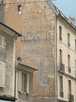  mur d'immeuble avec traces d'ancienne publicité